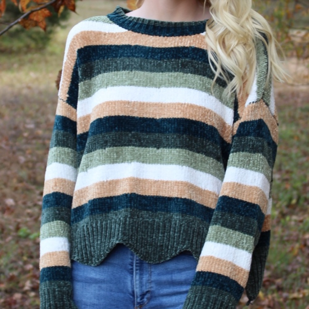 Green, white, and gold sweater